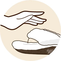 icon showing a hand hovering over a shearling slipper